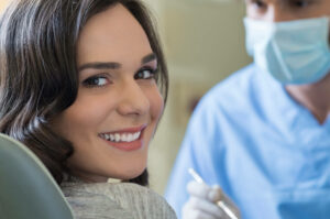smiling women visiting a emergency dentist